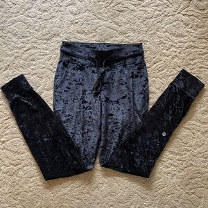 Black Lululemon crushed velvet joggers with pockets and drawstring